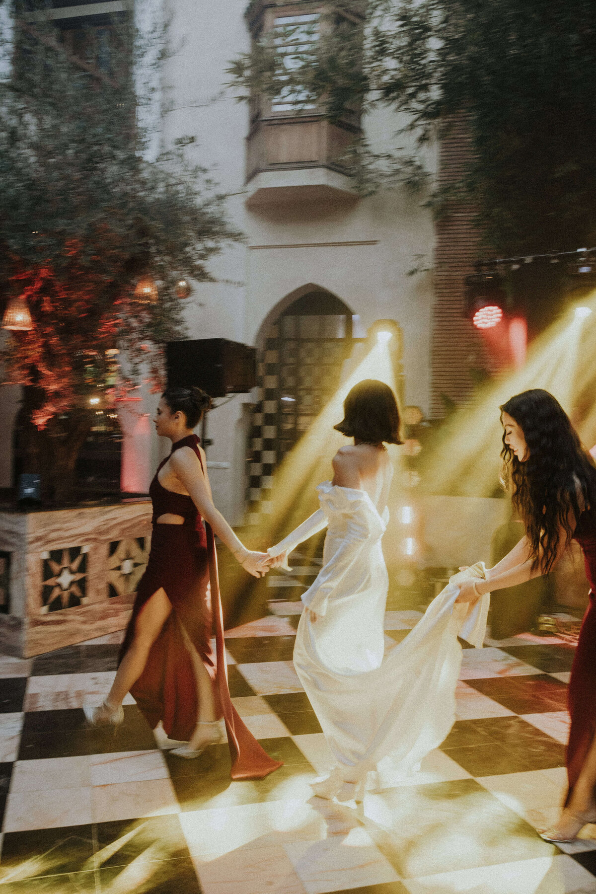 Bridesmaid and Bride Dancing