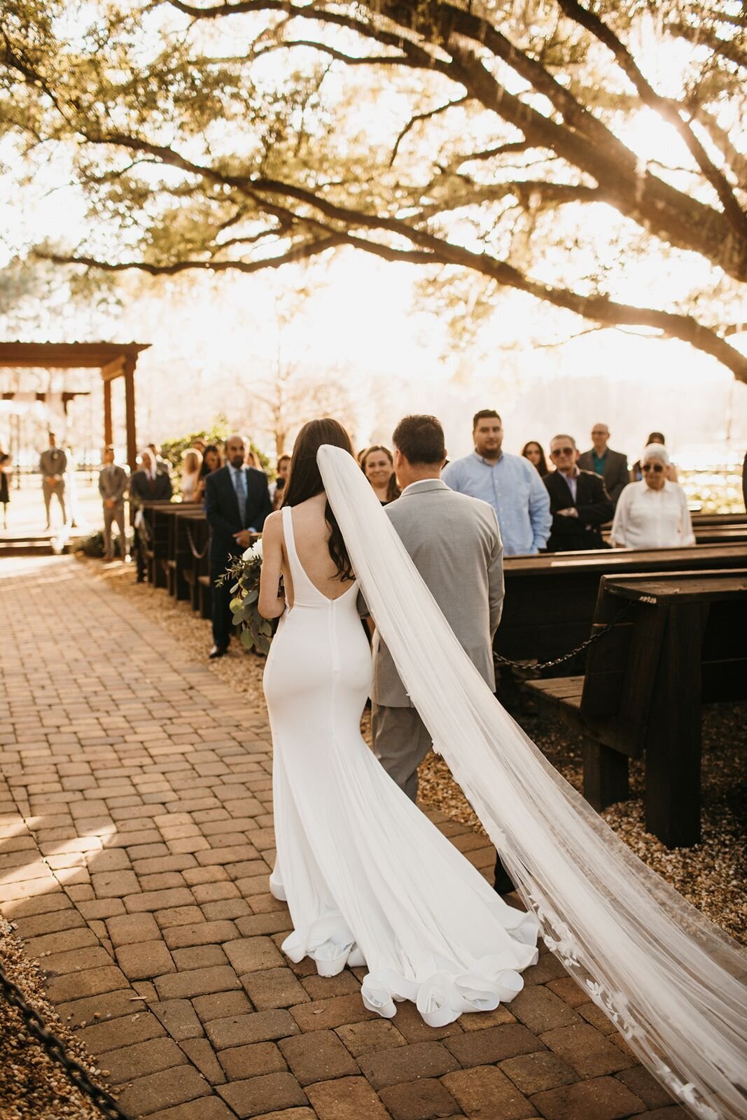 Father walking bride down the aisle at Club Lake Plantation in Apopka, FL