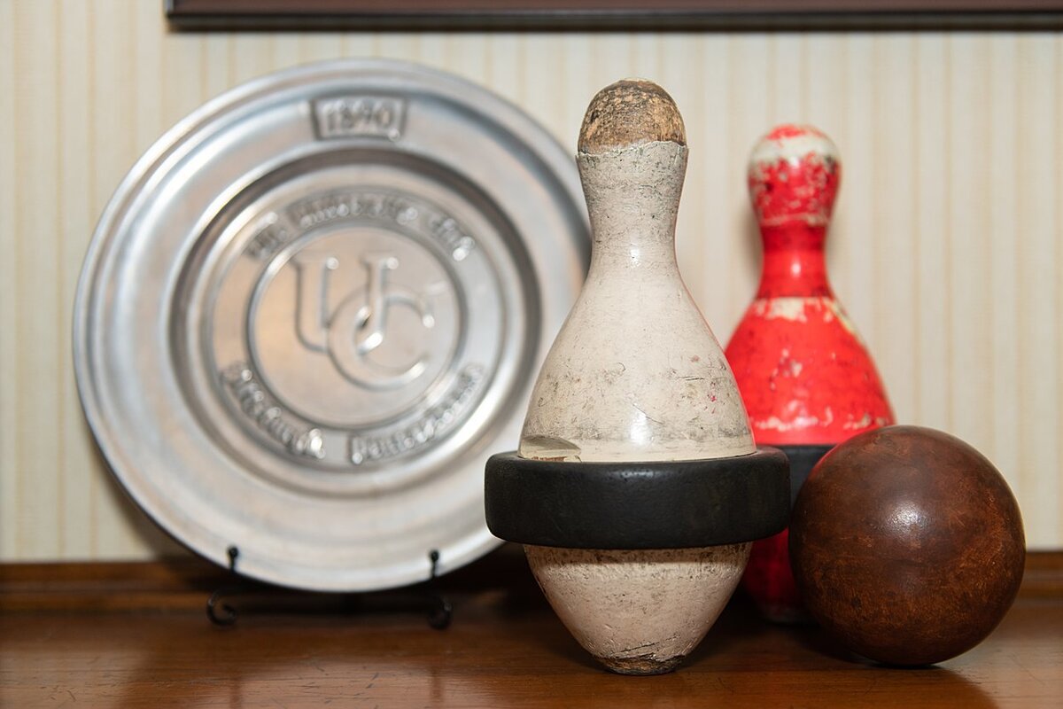 Silver University Club plate with antique bowling pins and ball at University Club in Pittsburgh, PA