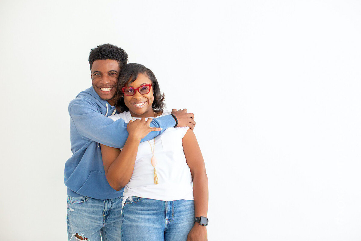 Two teenagers posing together during their Bucks County family photo session, sharing a relaxed and genuine moment