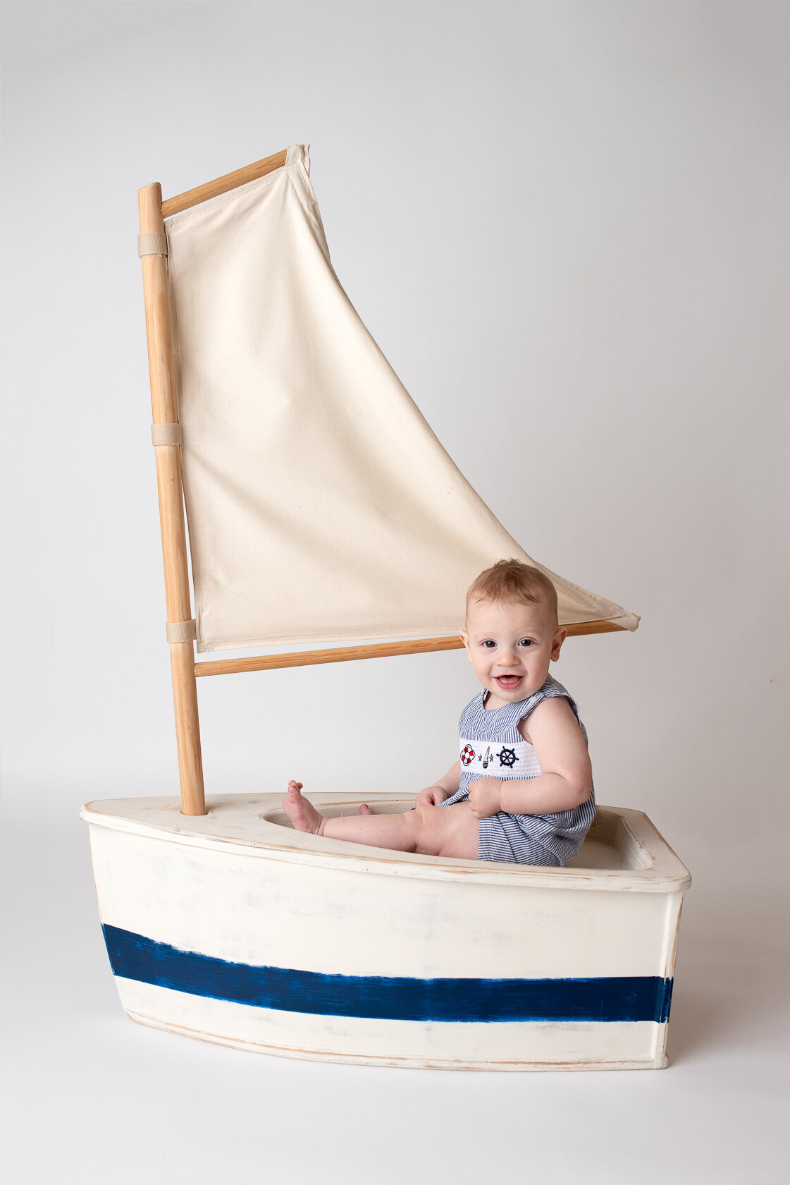 Baby in a creative boat background captured by Laura King, Houston Photographer