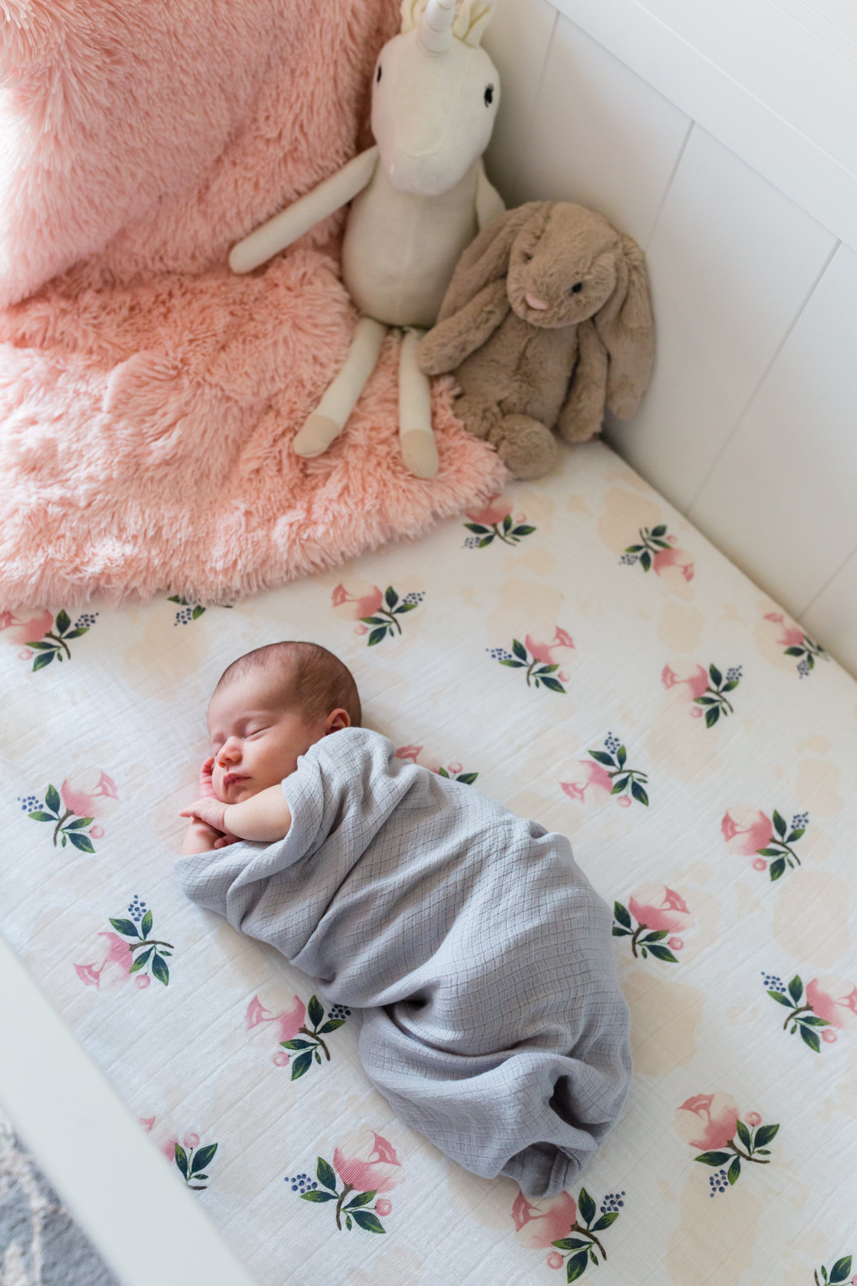 Baby in crib with stuffed animals - Jen Madigan - Naperville Lifestyle Newborn Photography