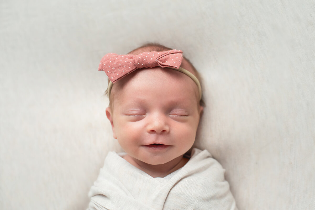Cuyahoga-Falls-Newborn-Photographer-happy-baby-girl