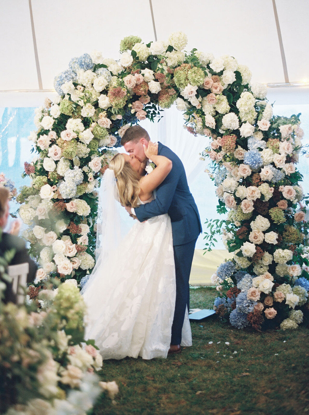 Kate_Murtaugh_Events_Cape_Cod_tented_wedding_ceremony_first_kiss