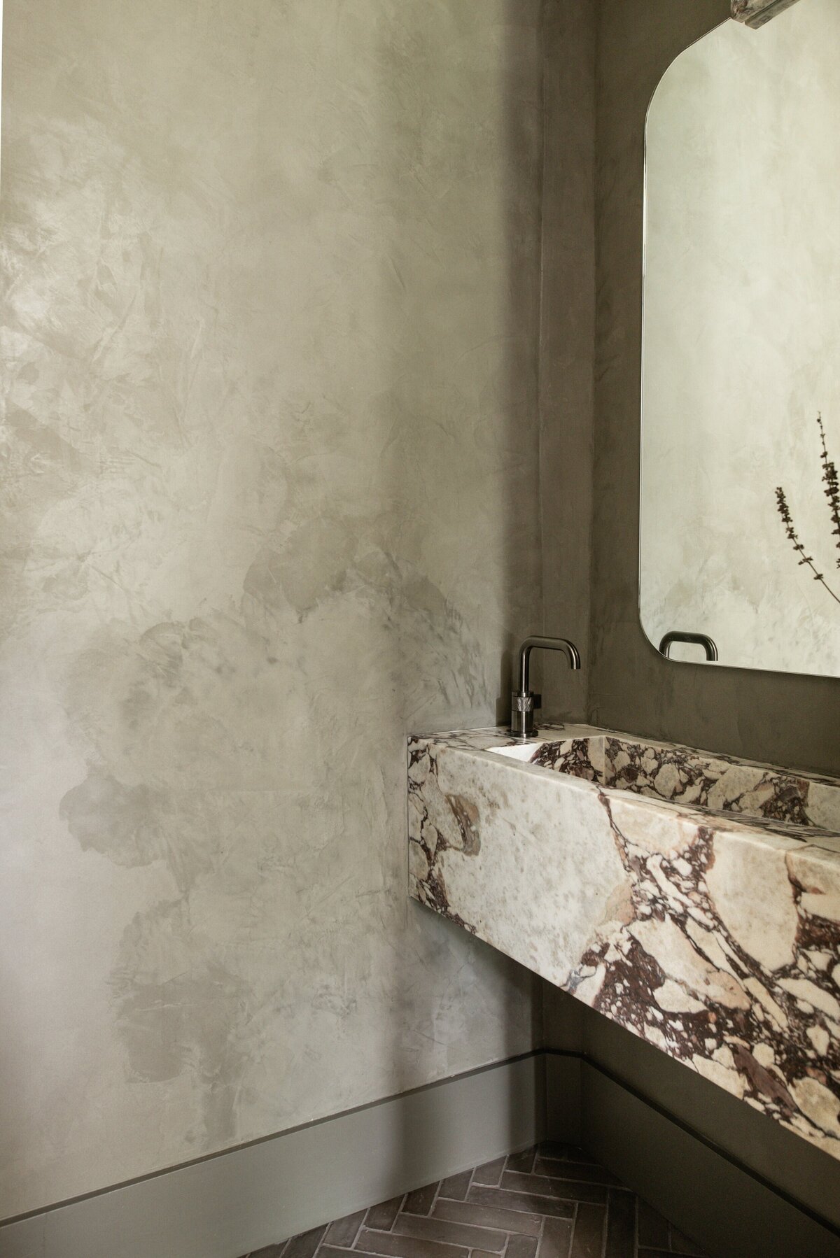 house-franc-toro-canyon-westlake-moody-bathroom-powder-room-remodel-renovation-calacatta-viola-marble-custom-stone-vanity-herringbone-belgian-terracotta-floor-tile-plaster-walls-roman-clay-brizo-faucet-historic-neighborhood-austin-texas
