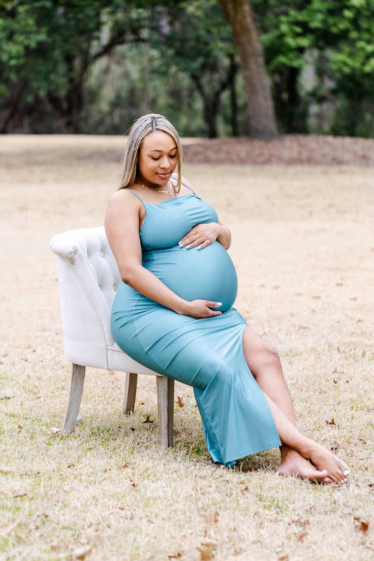 pregnant momma in teal dress expecting her new baby any day in Lexington SC