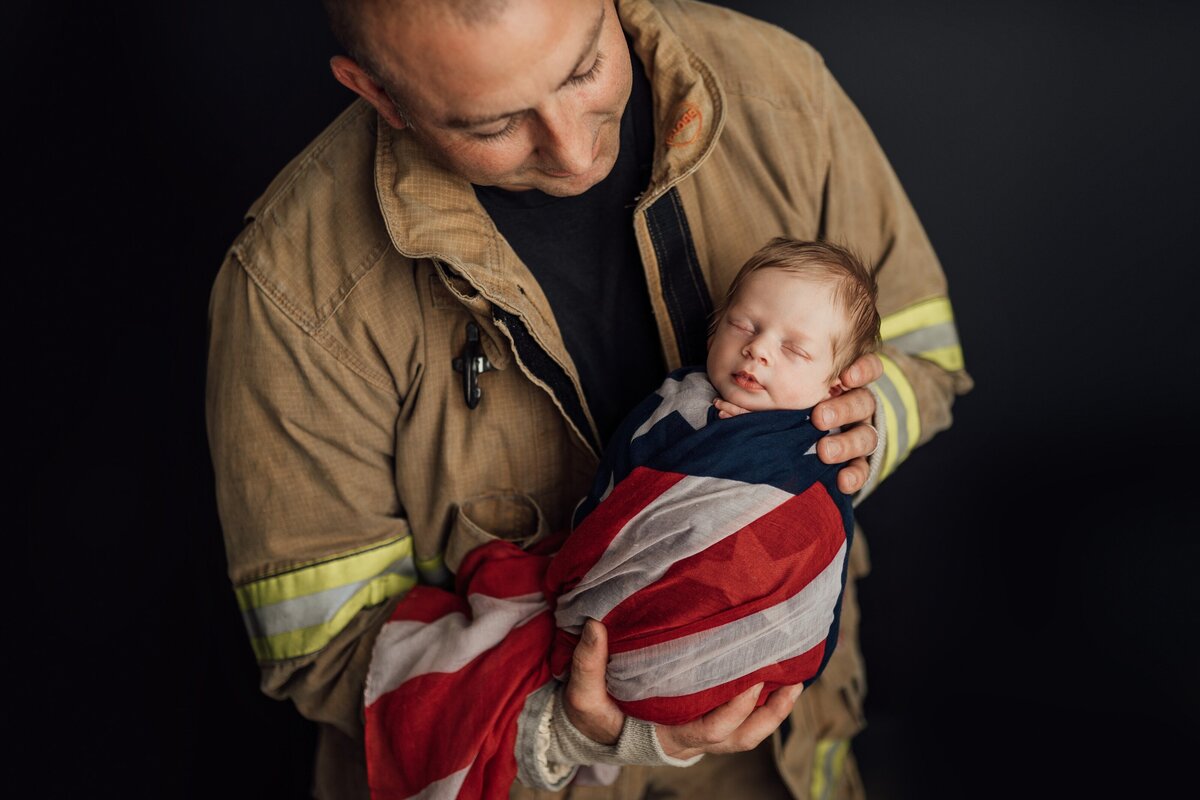 firefighter with new baby at studio in tampa