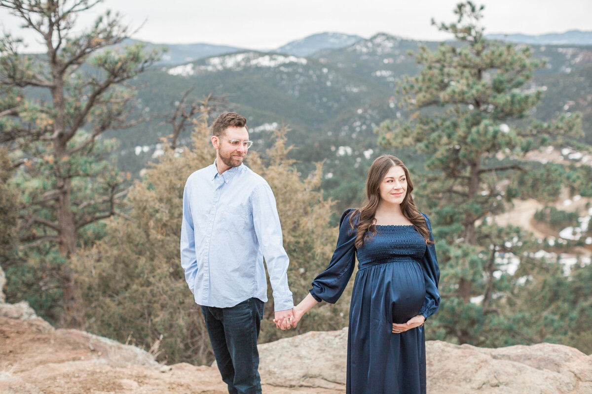 Couple during maternity photos in the mountains in Golden, Colorado