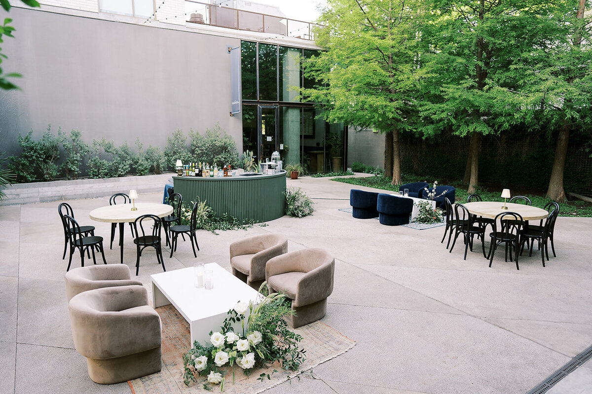 The courtyard at South Congress hotel transformed into a chic bar space with modern lounge furniture