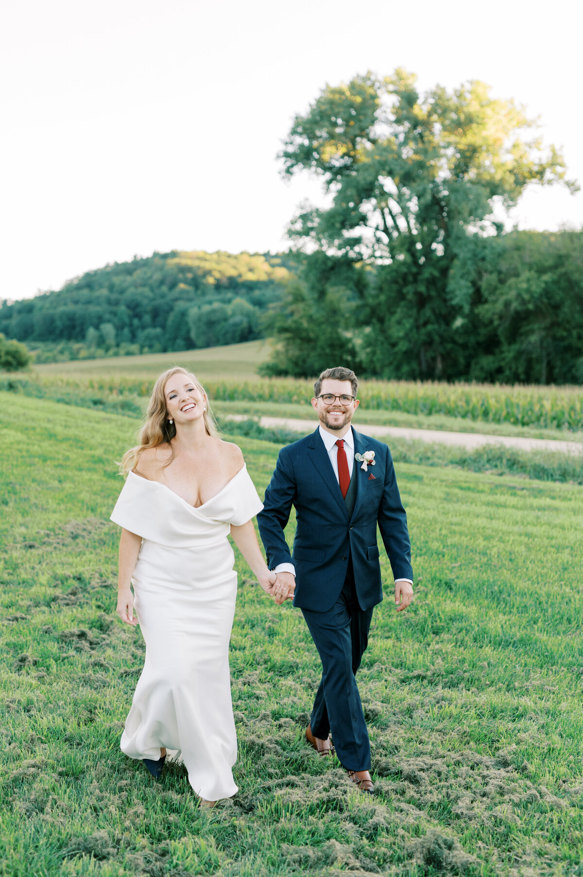 Bride and groom walking together at Willow Brooke Farm