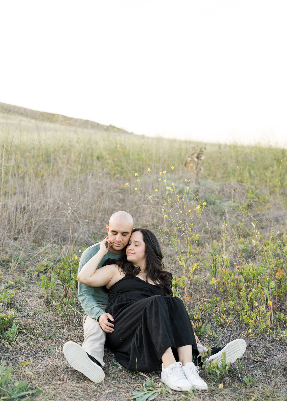 romantic engagement photo in open field