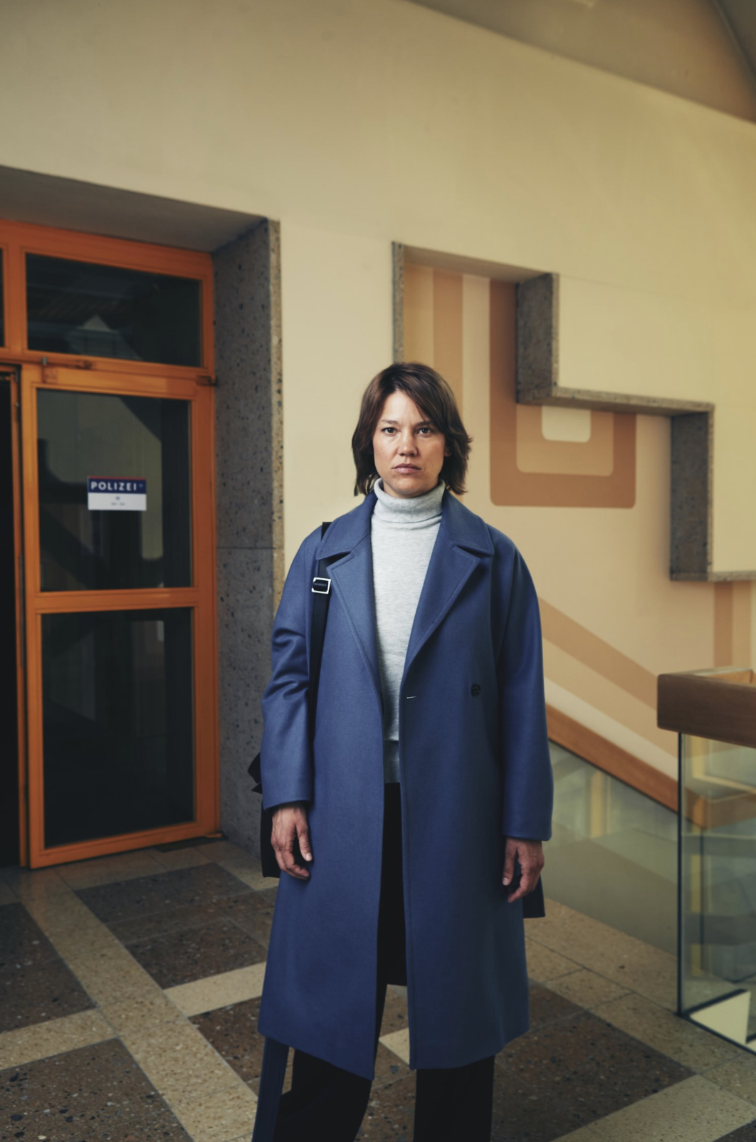 A wide-angle portrait shot with stylized depth and movement.