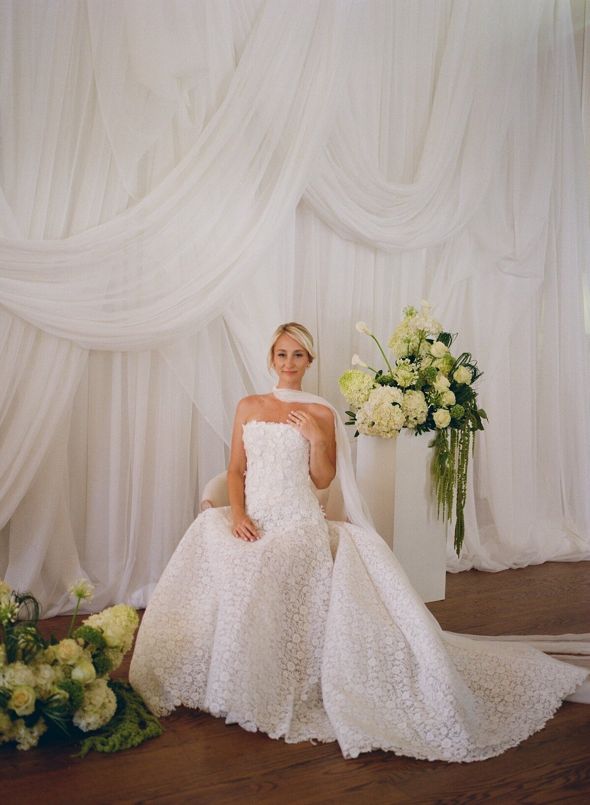 Bridal portrait with a draped white backdrop