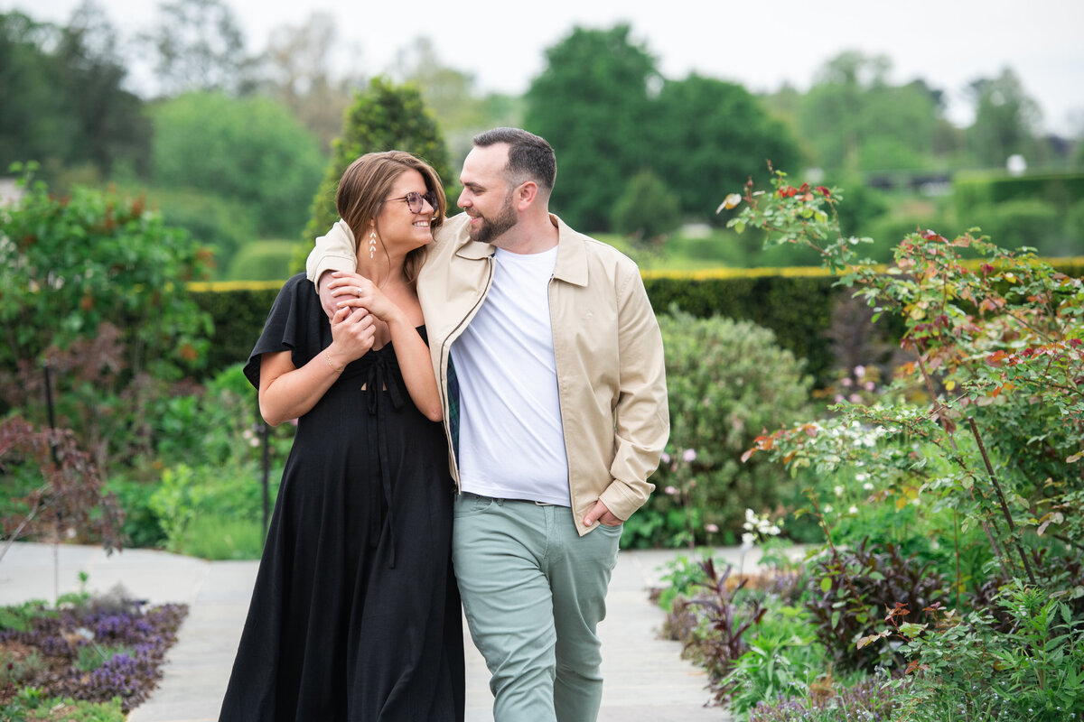arms_around_each_other_outdoors_engagement_photo