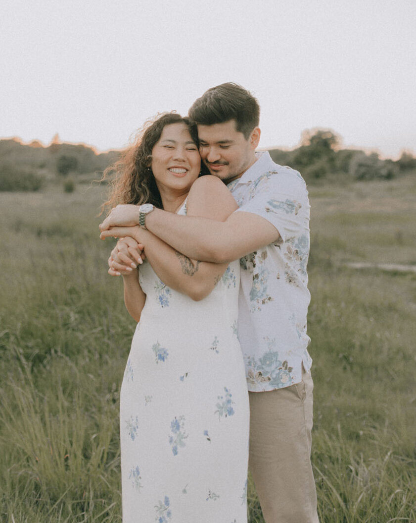 Guy embraces girl from behind