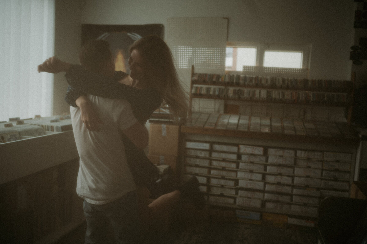 Engaged couple vintage photograph taken at record store