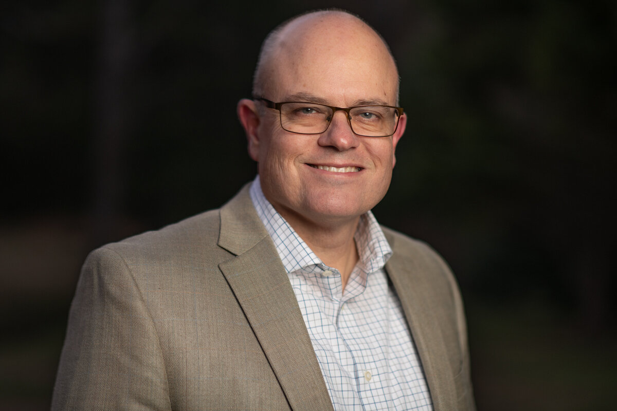 an executive poses for a professional headshot in chattanooga