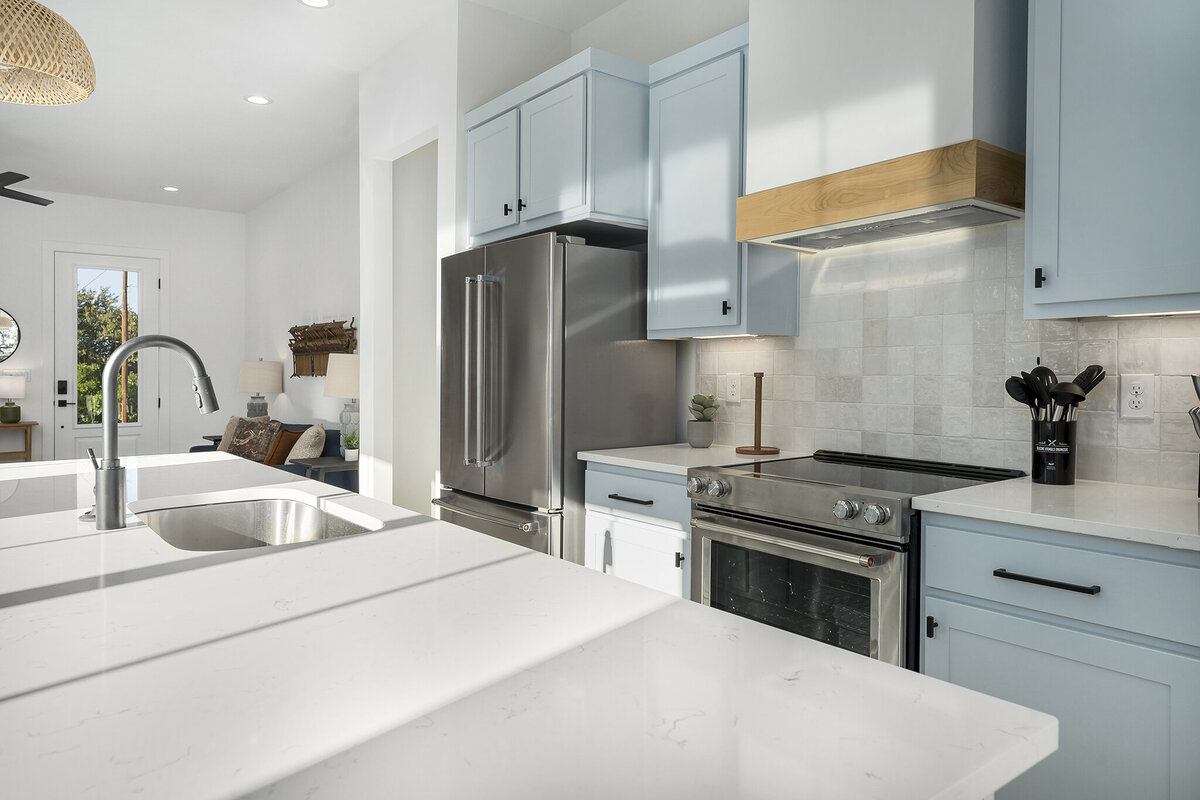 light blue kitchen cabinets with black hardware