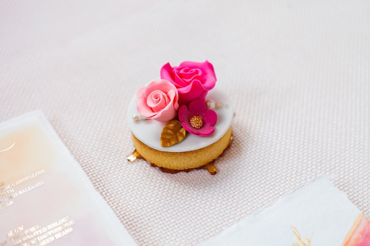 mini iced biscuit with pink sugar flowers