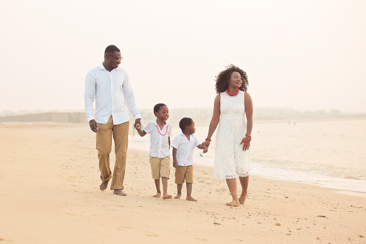 african-family-walking-on-the-beach