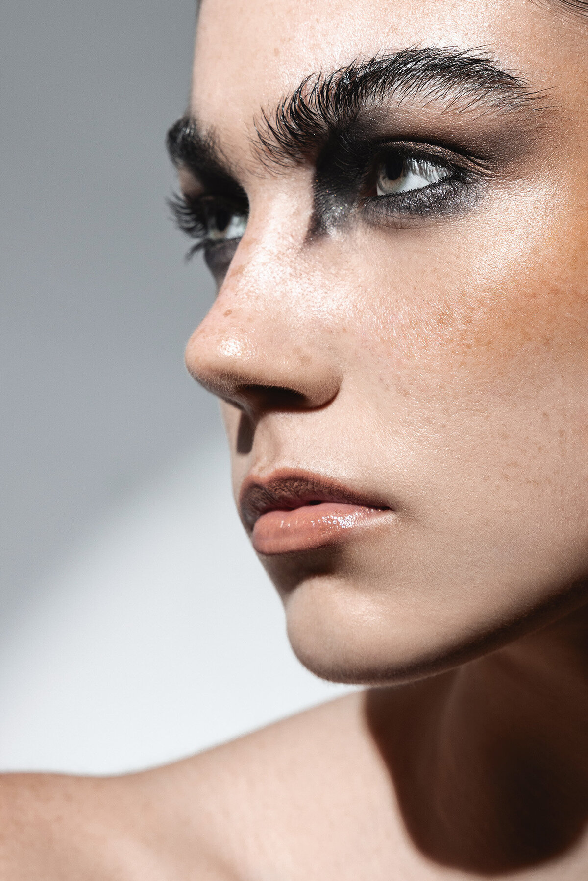 Beauty photography close-up with bold lihting, beige background