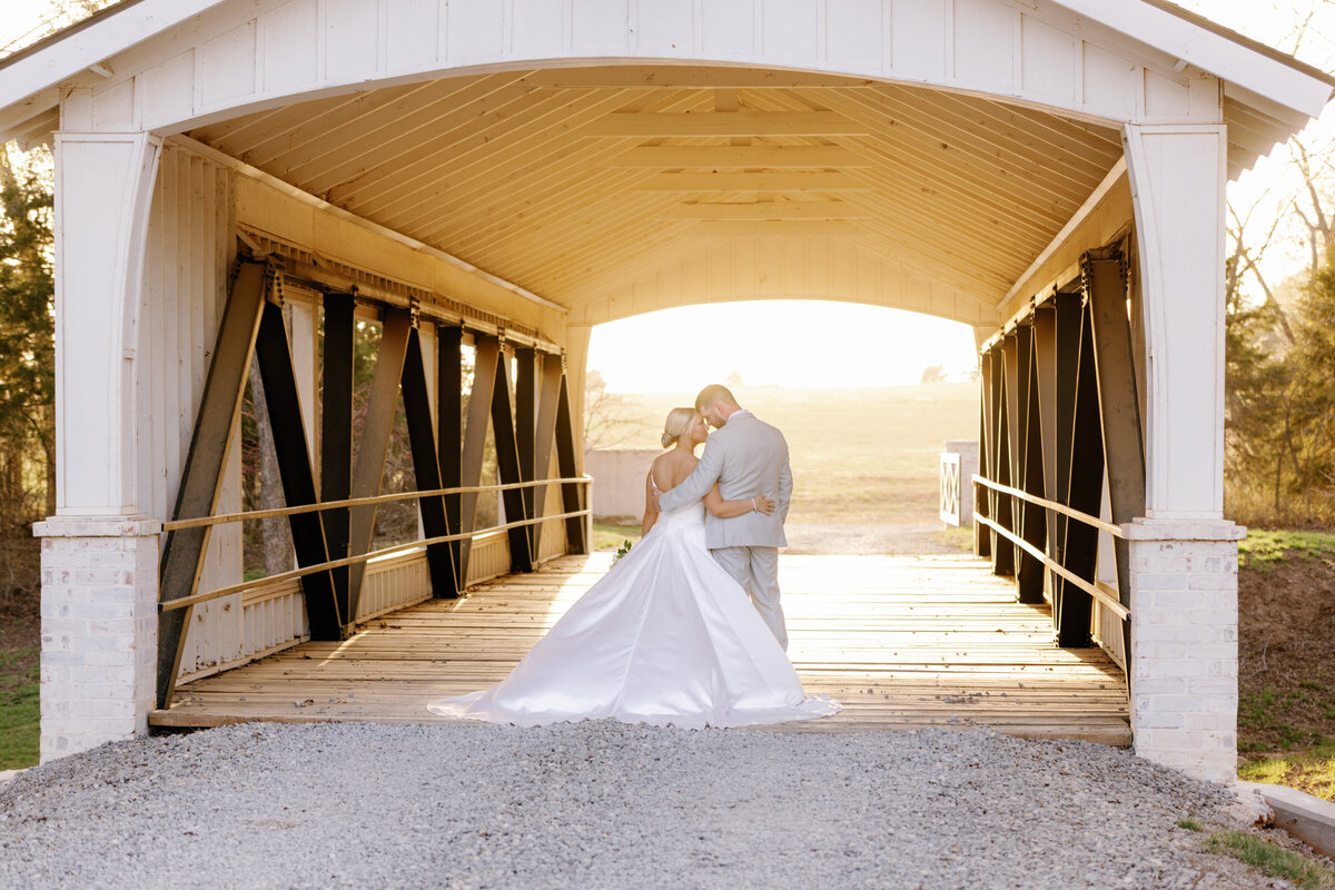 Summertime mountain wedding with bride and groom holding hands