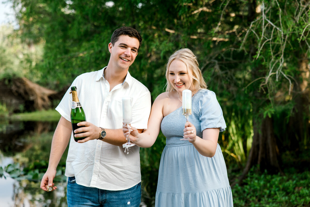 couple laughing drinking champagne