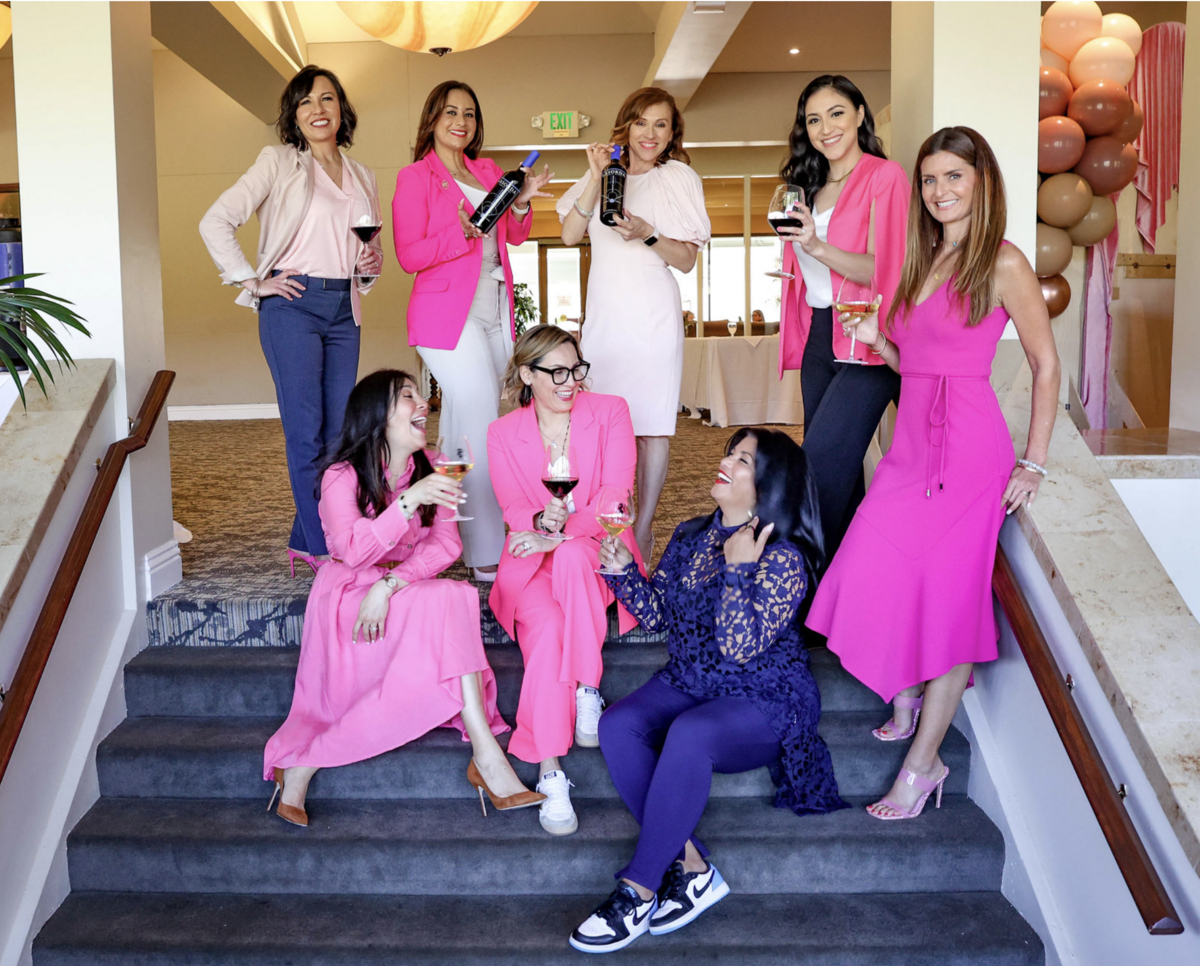 Photo of Jackie and women at an event smiling