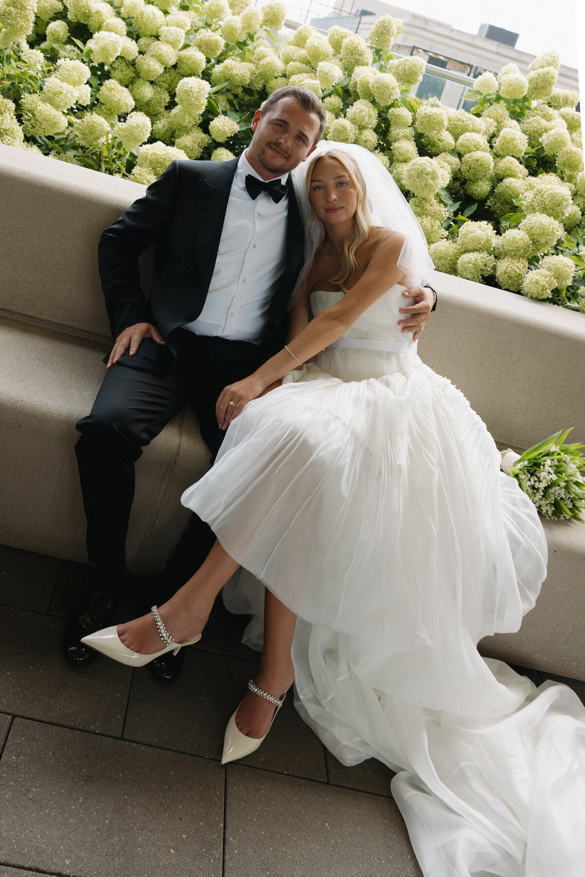 Sophisticated editorial wedding photography captures ceremony elegance at Old Post Office Chicago, featuring Lauren Alatriste's fashion forward approach combining architectural grandeur with magazine-worthy imagery and authentic wedding emotion.
