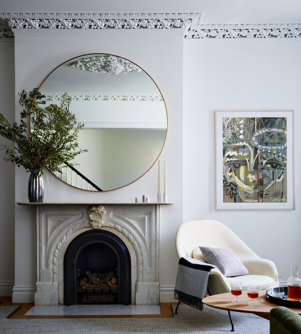 Classic South End brownstone by Sarah Scales Interior Design, Boston. Historic fireplace, gallery-like walls, mid-century touches, and contemporary art create a timeless living room interior.