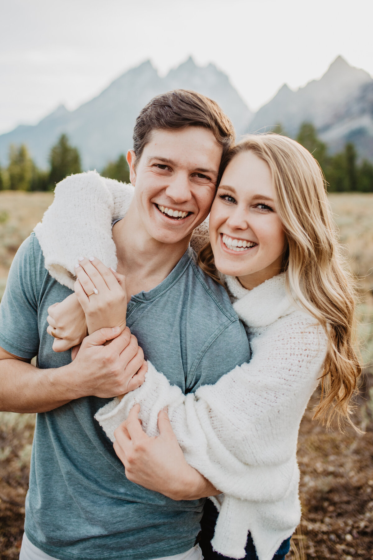 Photographers Jackson Hole capture couple laughing and smiling together during Tetons engagements
