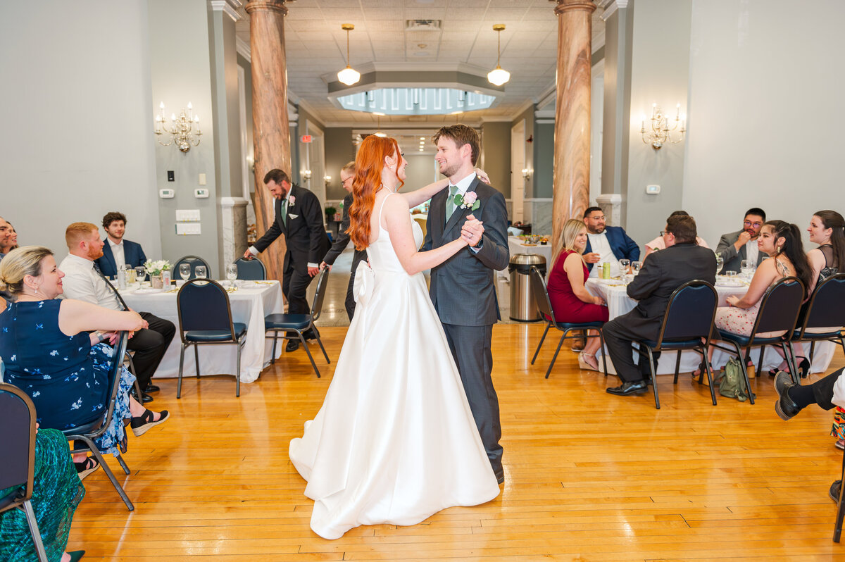 bride and groom having fun during their first dance