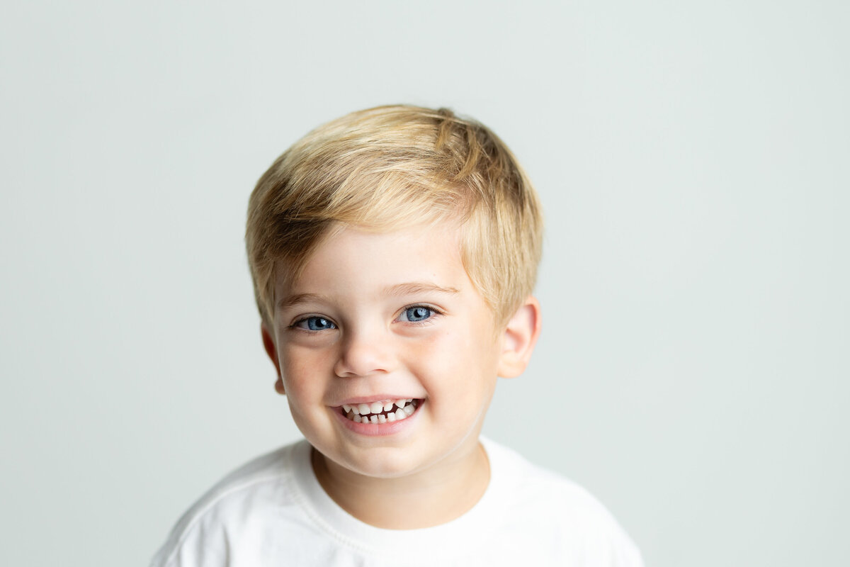 Smiling toddler enjoying a kids photography session in Canton, GA