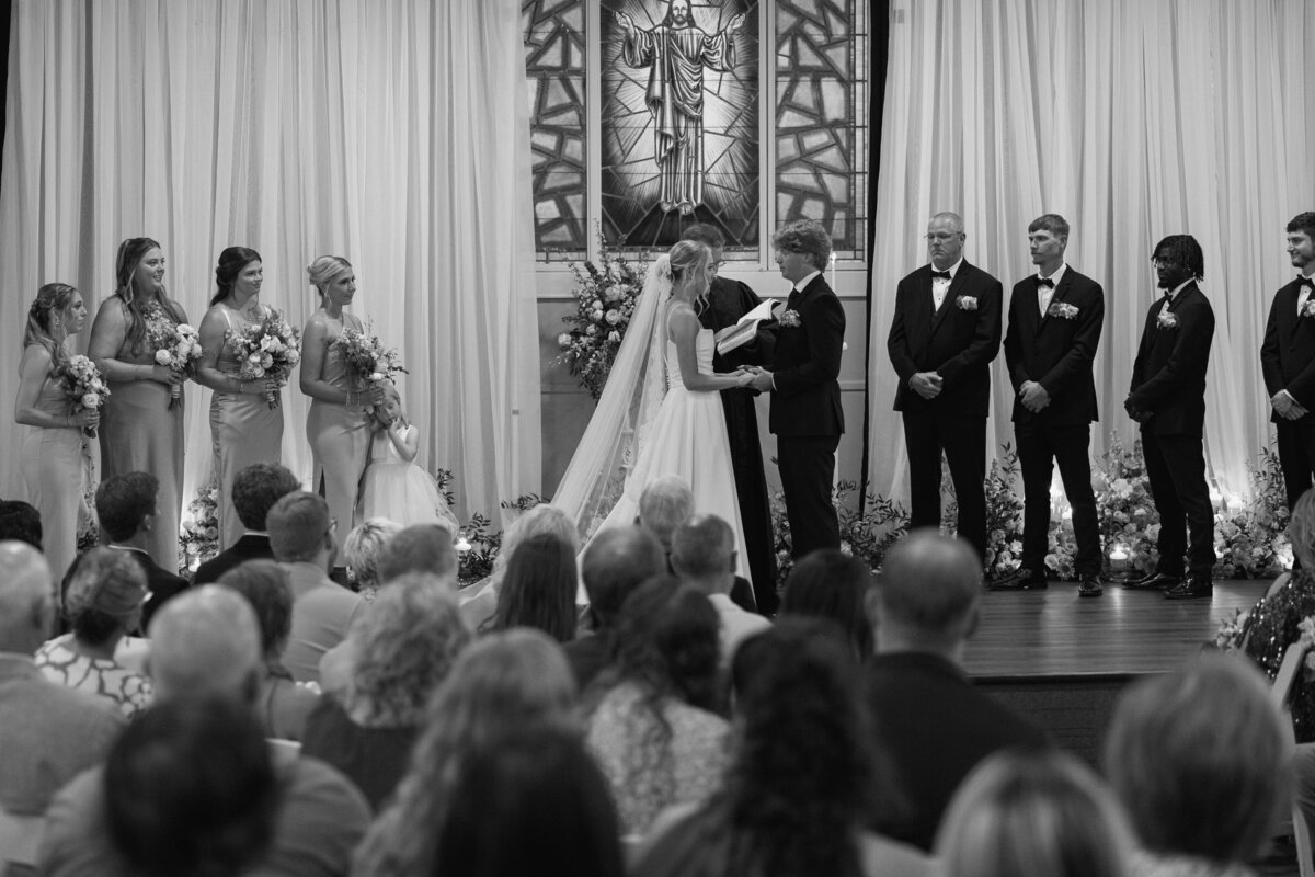 Bride and groom exchange vows during church ceremony