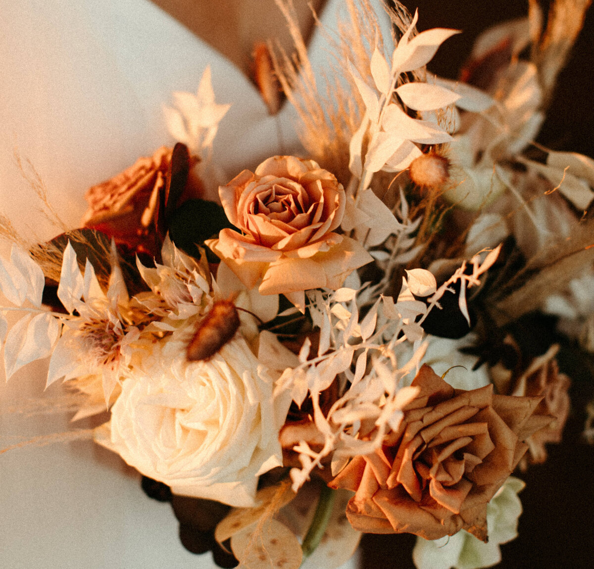 Bridal bouquet made with dried florals with golden hour sunset lighting