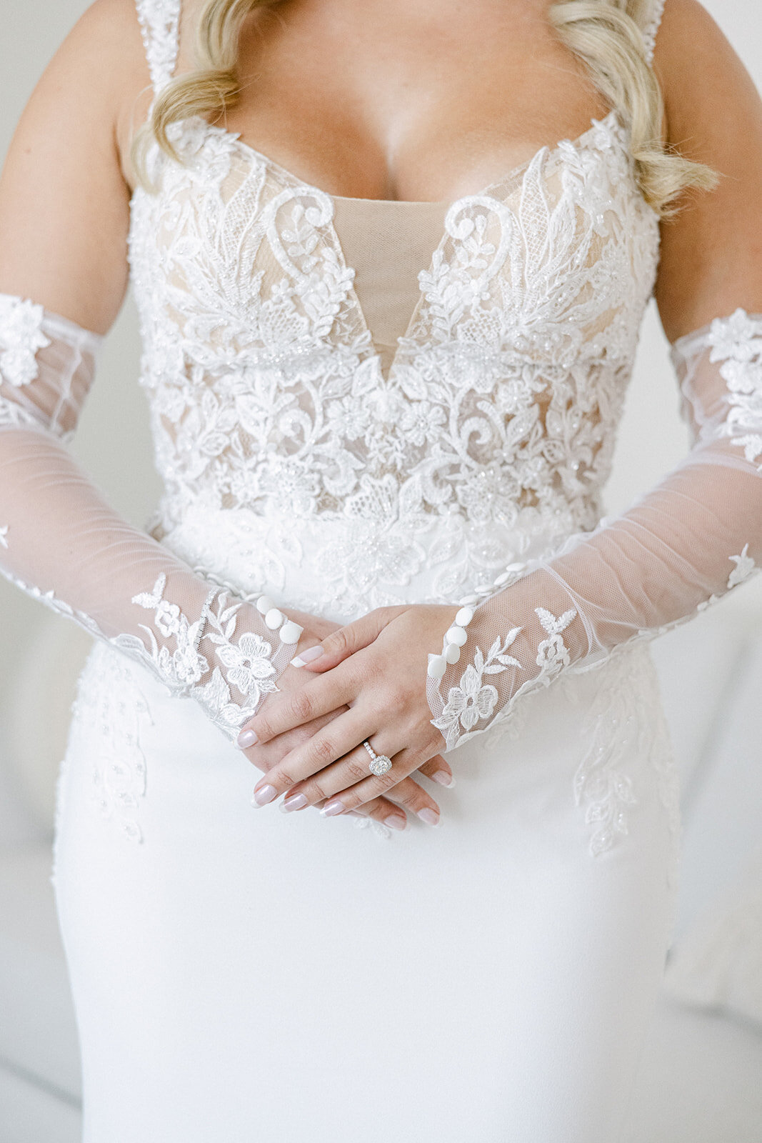 close up of the lace on a bride's wedding dress