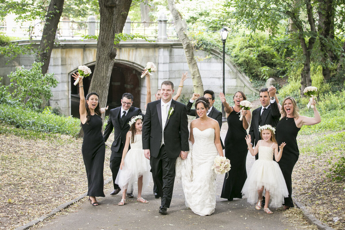 bridal party walking in a park