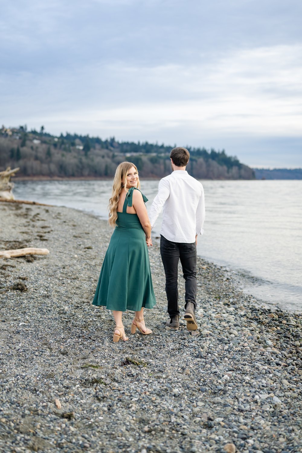 walk on beach man and woman engaged