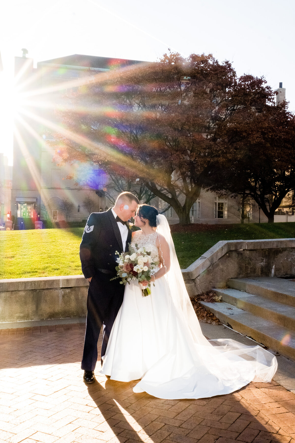 sunlight shining brightly behind married couple