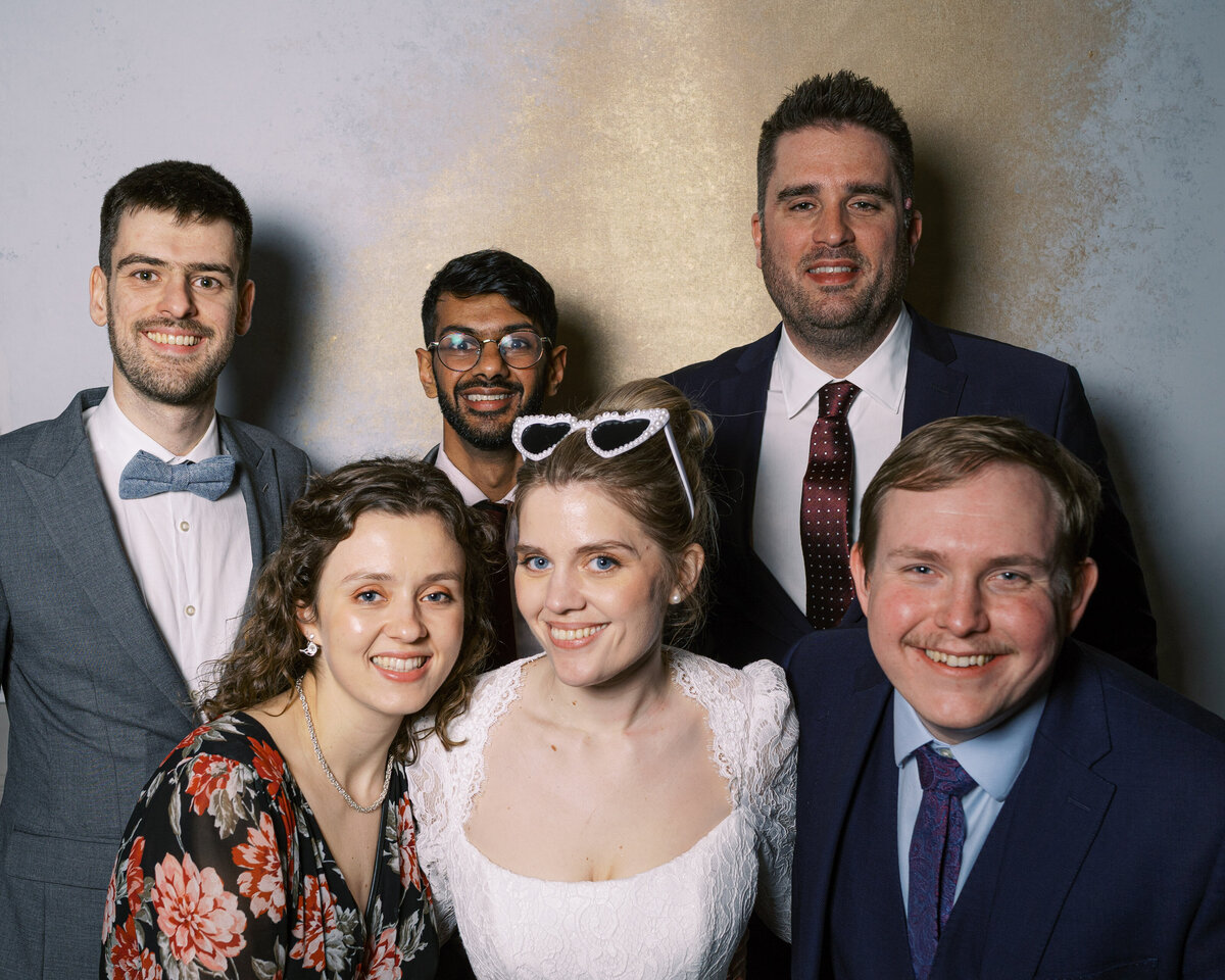 Bride and guests in wedding portrait studio wedding photobooth