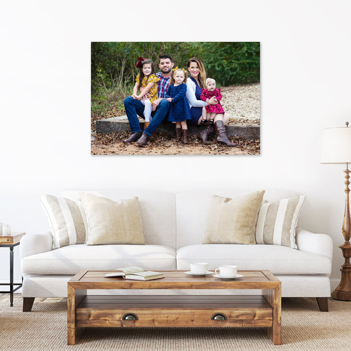 framed family portrait hanging above couch