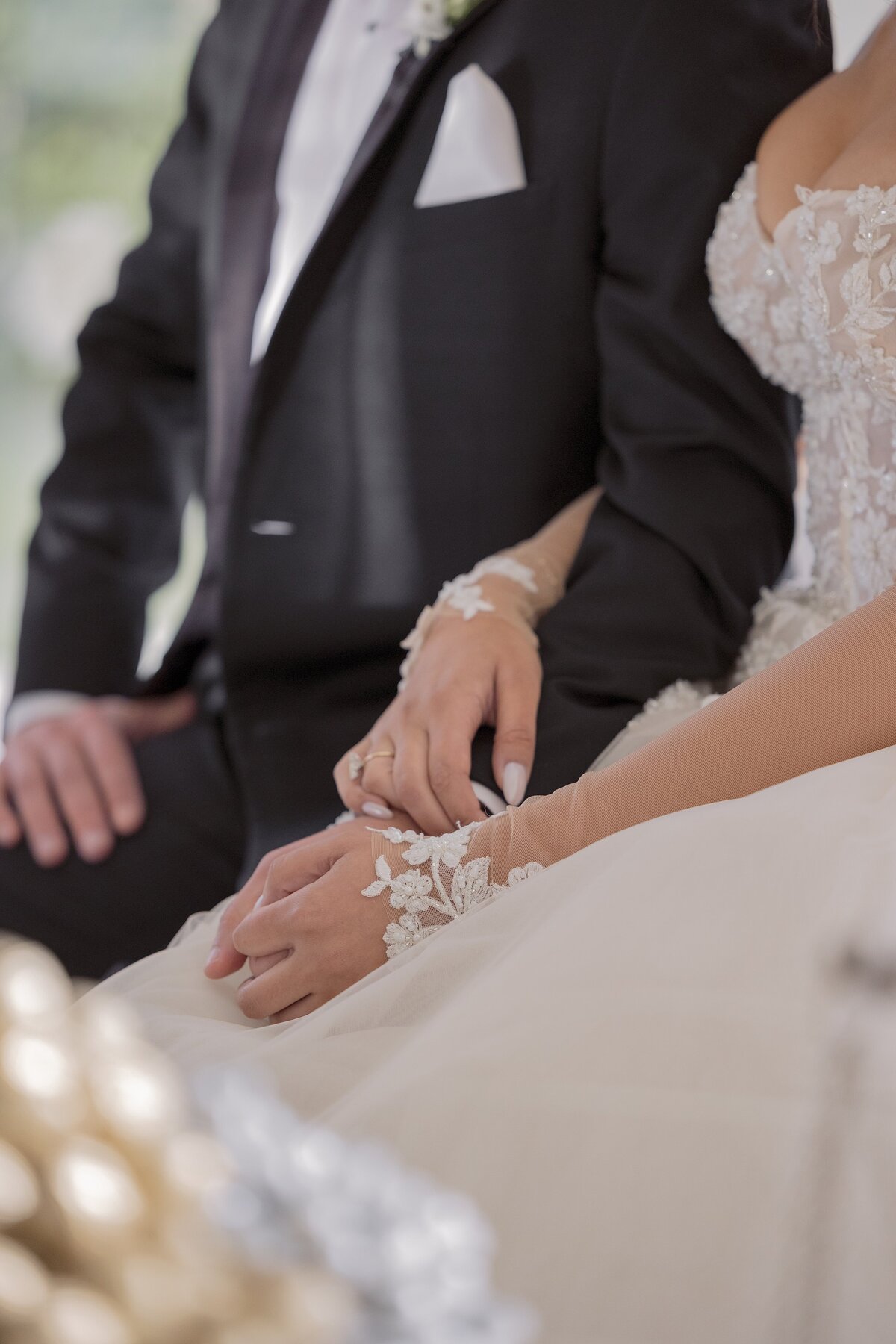 Bride and Groom sit at Sofreh Aghd during Persian wedding ceremony at Belle Mer, Newport.