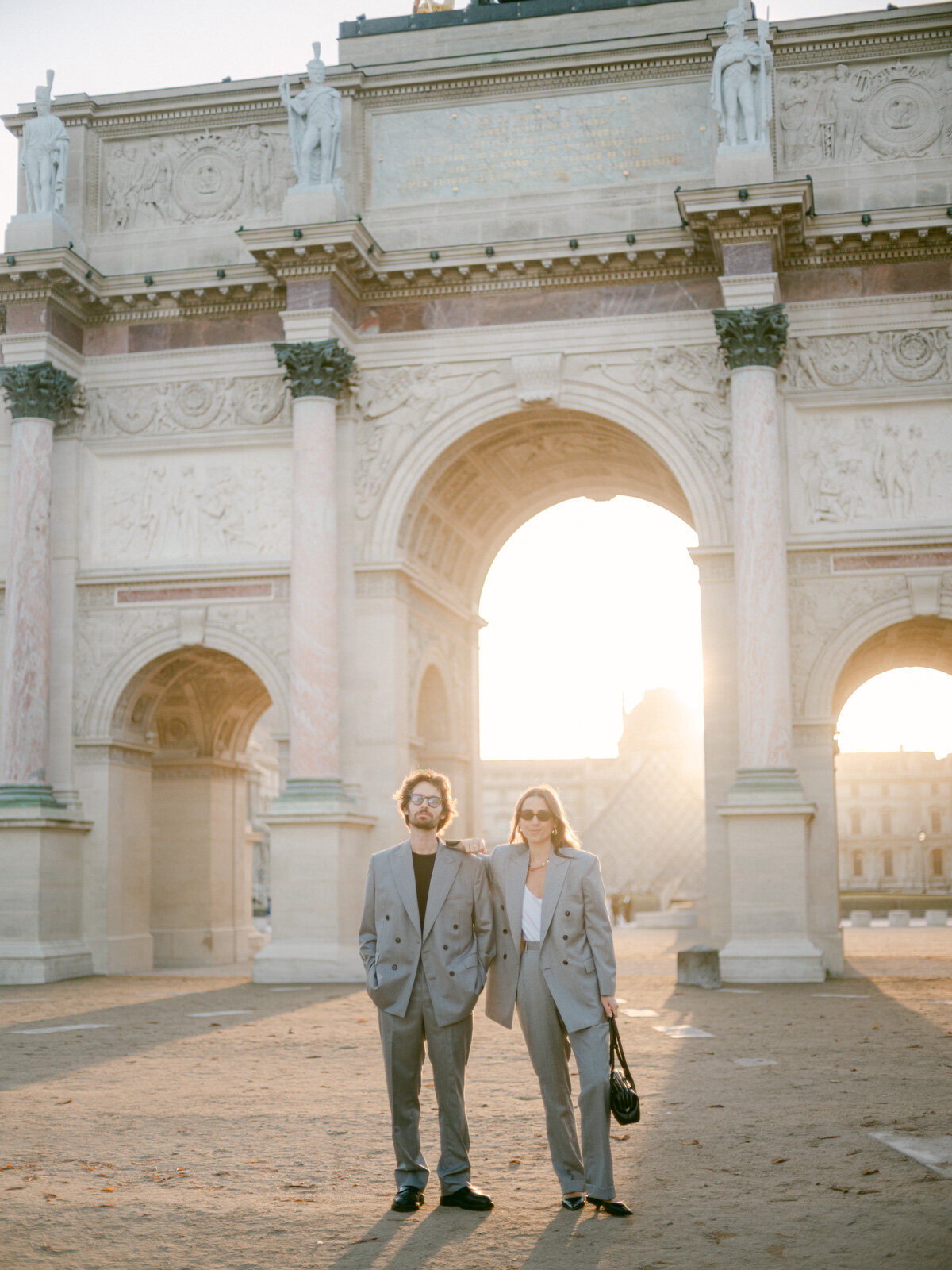 Couple photo session at the Tuileries and Louvre in Paris, showcasing timeless love and classic Parisian architecture.