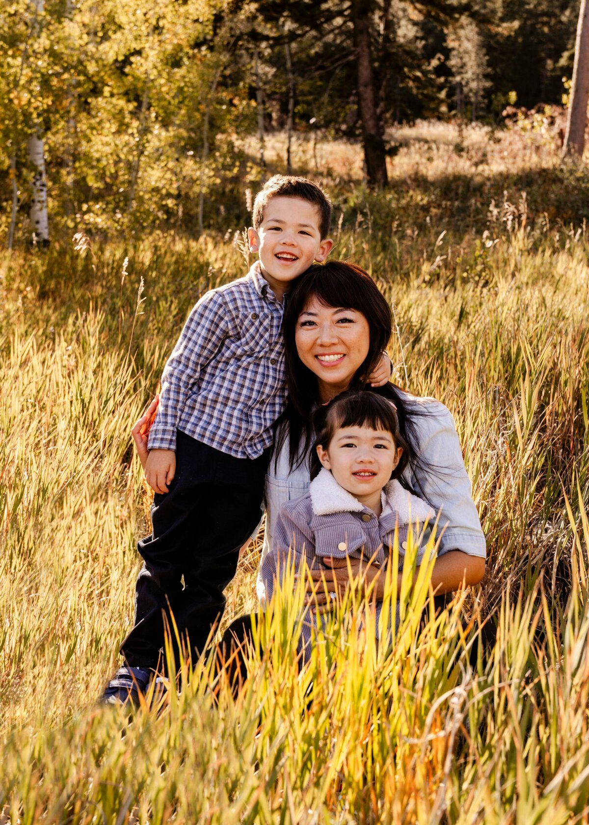 family smiling in field