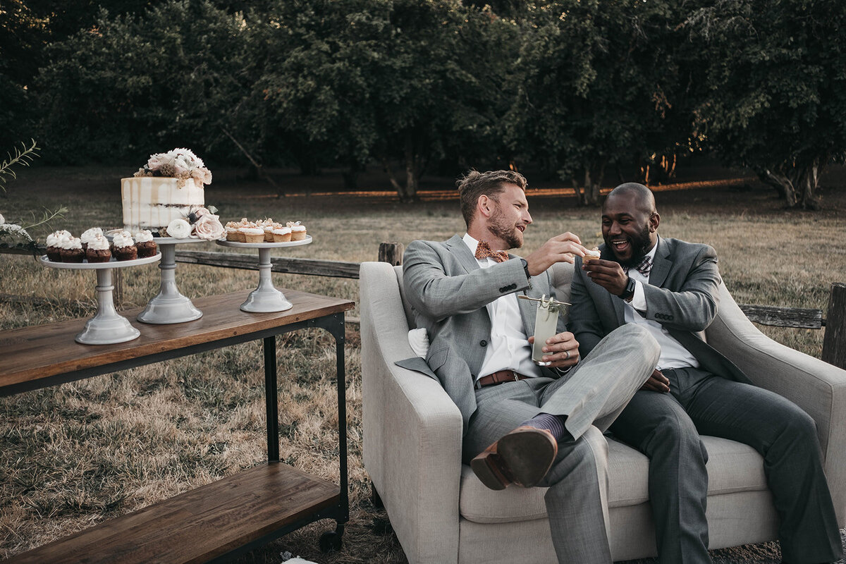 two men cheering glasses