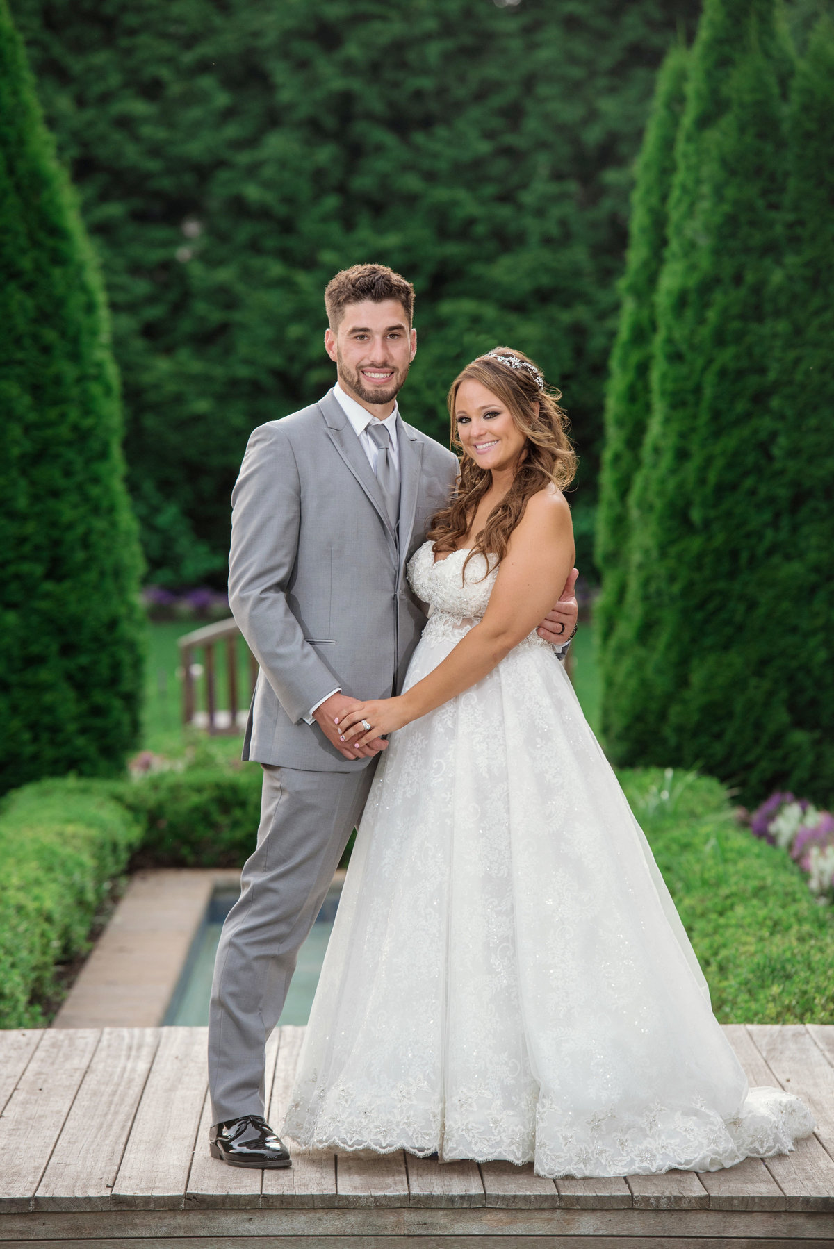 bride and groom holding hands at Larkfield Manor