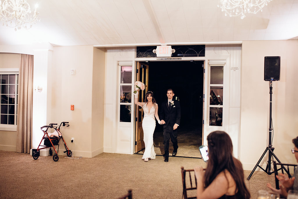 Wedding Photograph Of Bride And Groom Entering The Reception Hall Los Angeles