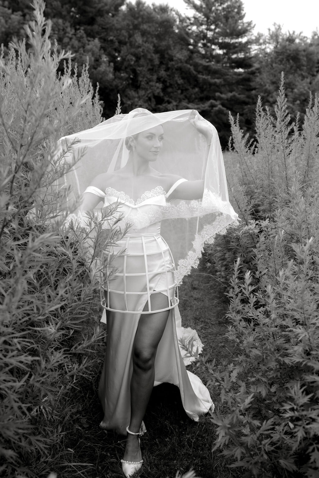 One-of-a-kind bridal gown with lace-edged veil for versatile styling
