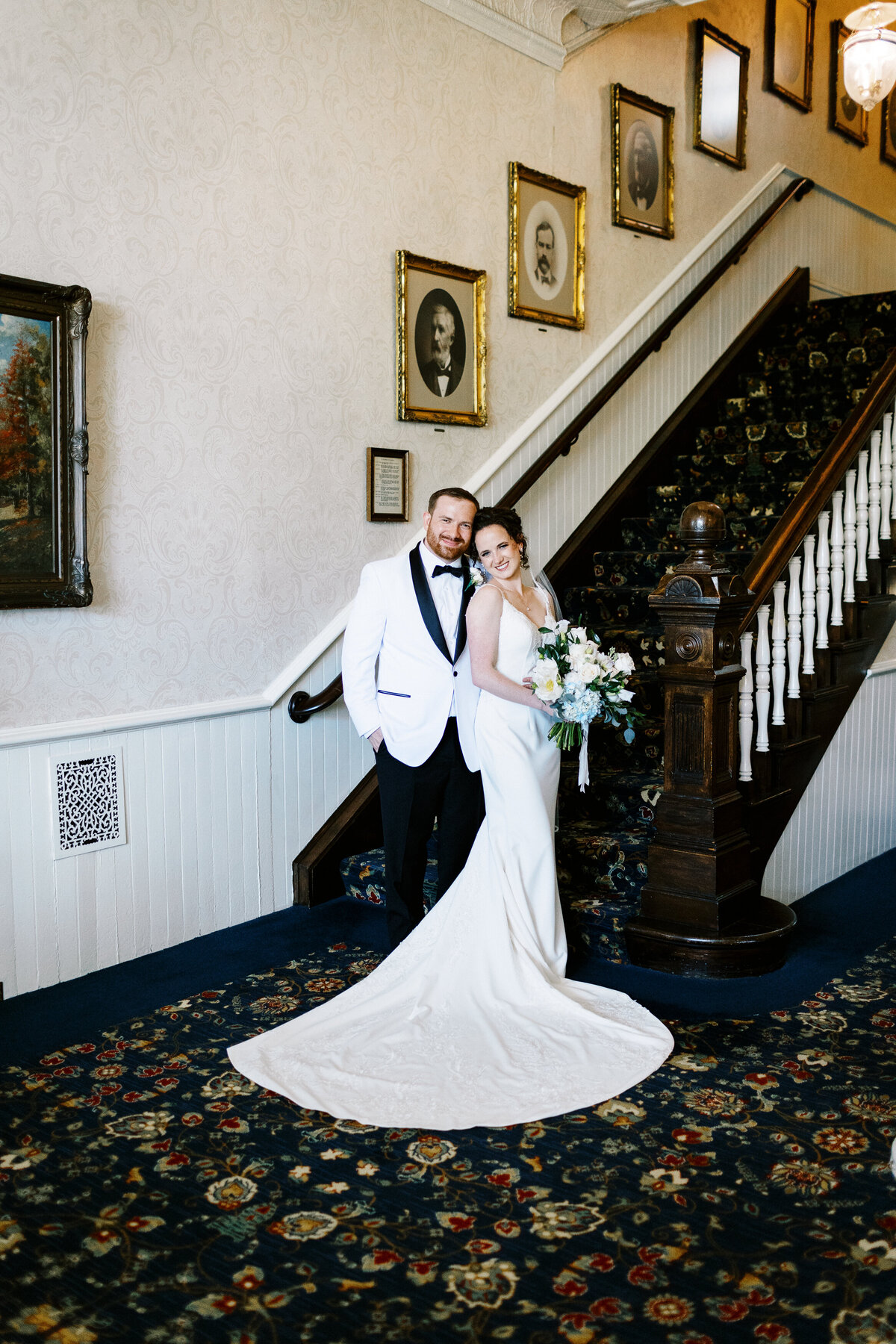 bride and groom posing for a photo at St James Hotel