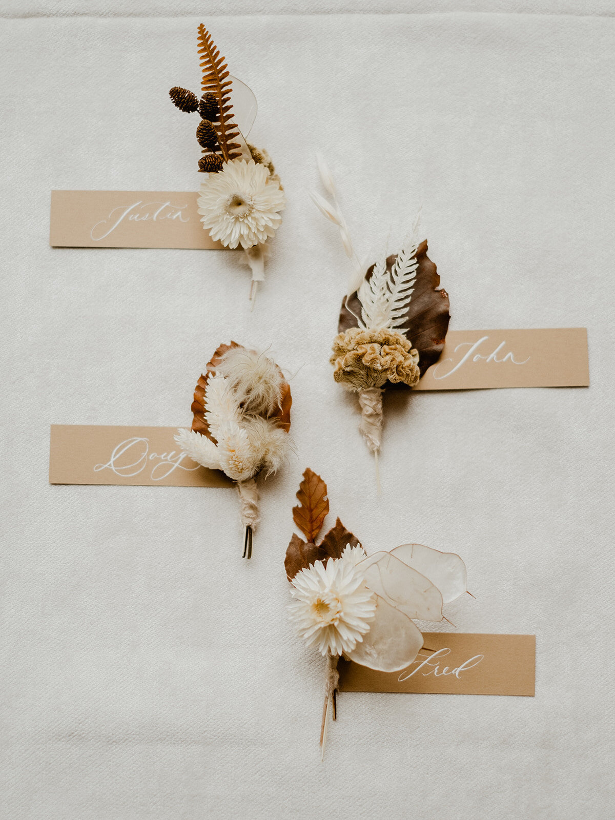 Boutonnieres for groomsmen at a wedding at the Hutton House in Medicine Lake Minnesota